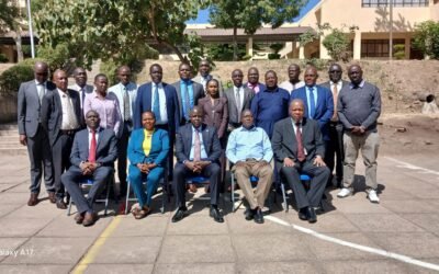 senior officers at Directorate of Criminal Investigations (DCI) taking photo outside at high-level Anti-Money Laundering (AML) sensitisation seminar in Mombasa