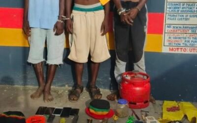 Robbery suspects with exhibits at Police Station