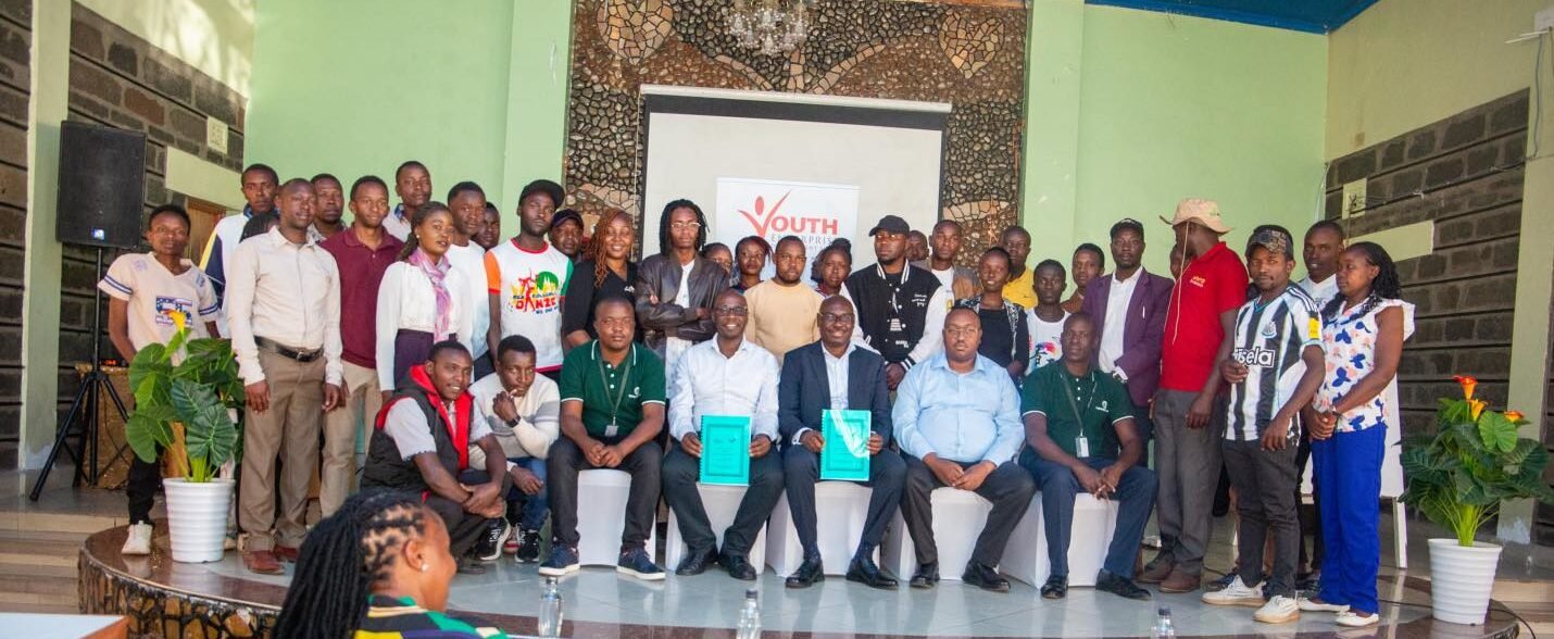 CPA Benedict Atavachi, CEO of the Youth Fund, poses for a group photo with participants at the Youth Agripreneurship Training Forum in Nakuru County.