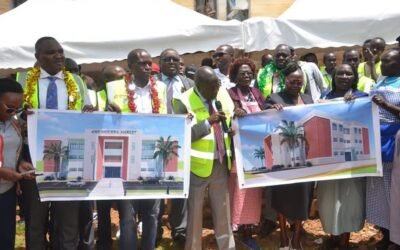 Baringo Governor Benjamin Cheboi and Baringo Central MP Joshua Kandie display architectural drawings at the Kabarnet Market site handover ceremony.