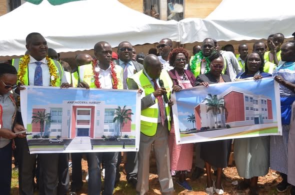 Baringo Governor Benjamin Cheboi and Baringo Central MP Joshua Kandie display architectural drawings at the Kabarnet Market site handover ceremony.