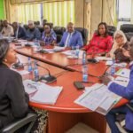 IEBC Chairperson Erastus Ethekon in talks with members of the COIN-10 delegation during a consultative meeting.