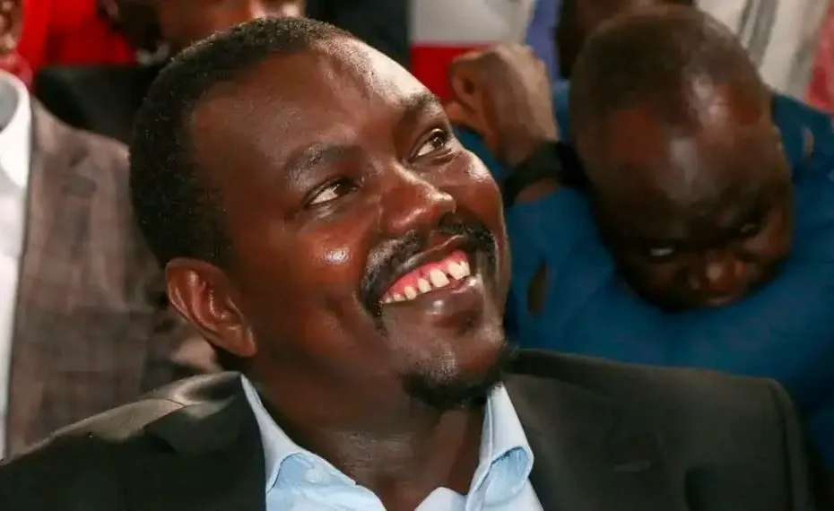 Uasin Gishu Senator Jackson Mandago smiling in a dark suit jacket and light blue collared shirt.