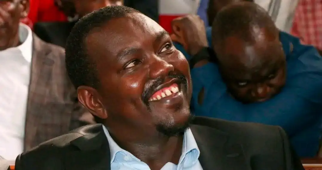 Uasin Gishu Senator Jackson Mandago smiling in a dark suit jacket and light blue collared shirt.