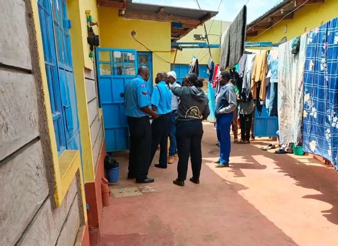 Kenyan police and detectives outside a blue door in a Gacagi, Thika residential area where a Thika medical student was found dead.