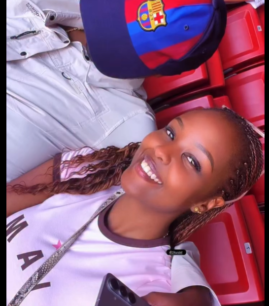 Naiyanoi Ntutu mystery man Instagram video selfie in stadium seats with Barcelona cap.