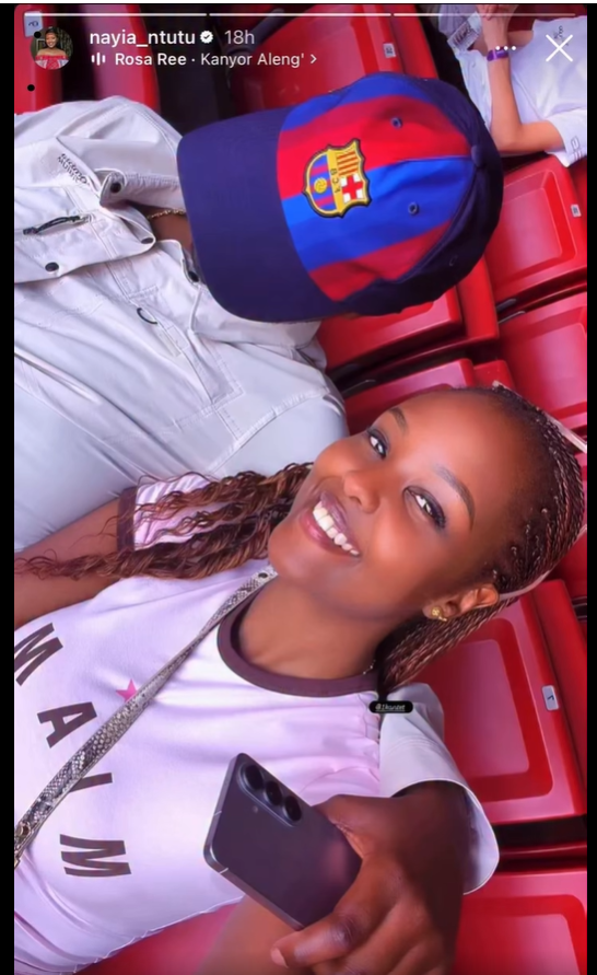 Naiyanoi Ntutu mystery man Instagram video selfie in stadium seats with Barcelona cap.