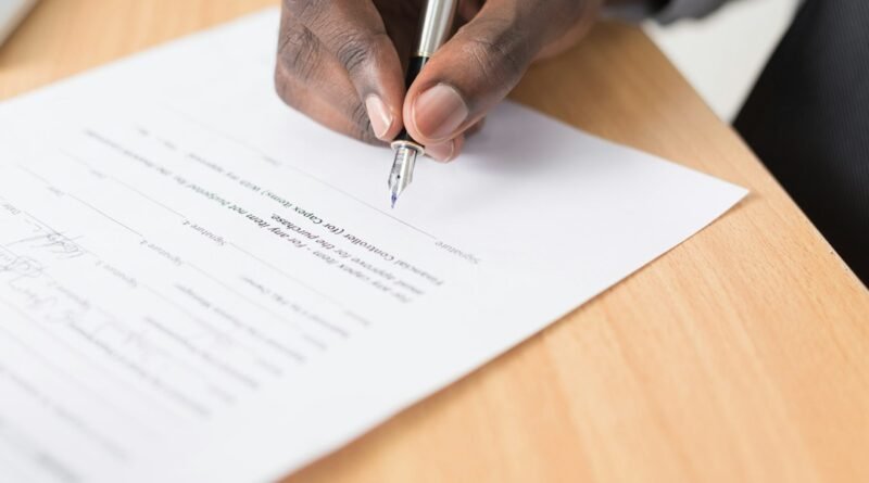 Property documents on a desk illustrating land verification and title searches in Kenya.