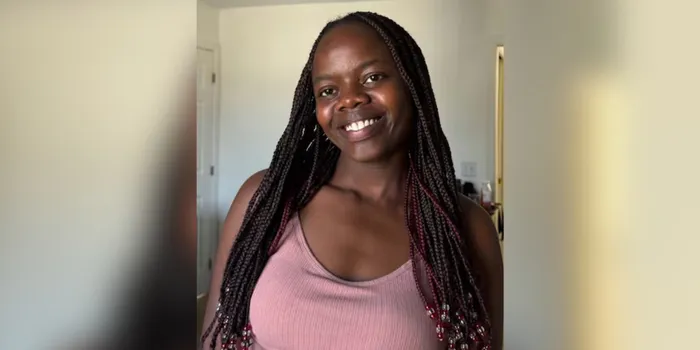 Benina Jepkoech posing for a photograph in Canada
