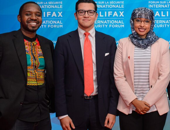 Boniface Mwangi attending Halifax International Security Forum in November 2017; not at 2026 Mashujaa Day