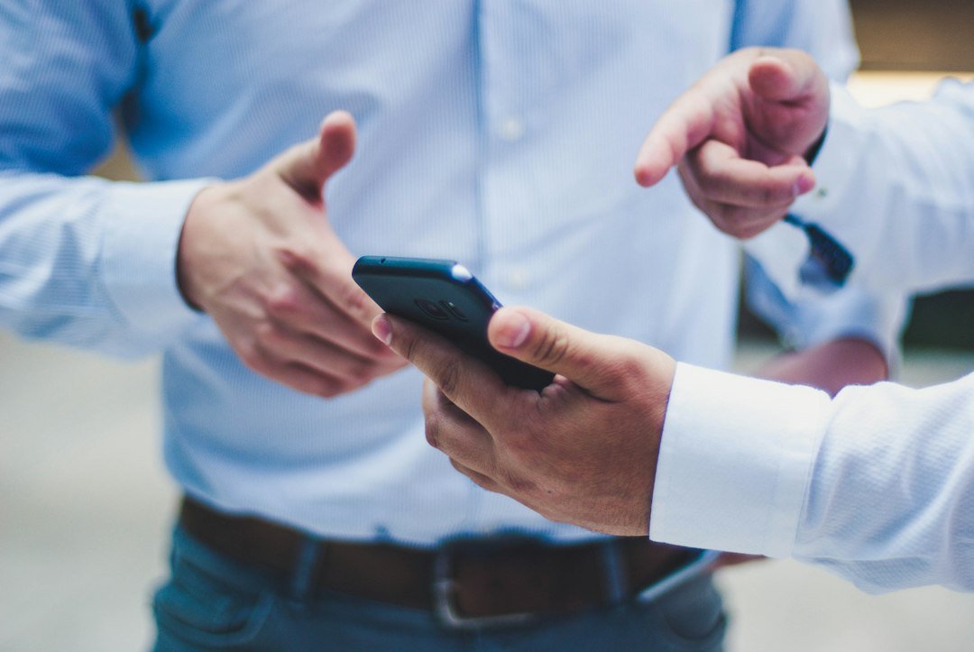 Smartphone being used for mobile finance, illustrating how to check whether a loan app is licensed by CBK.