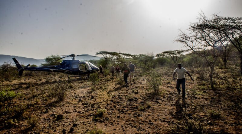 Conservationist approaching a helicopter in Kenya in 2017; not the Kericho helicopter crash