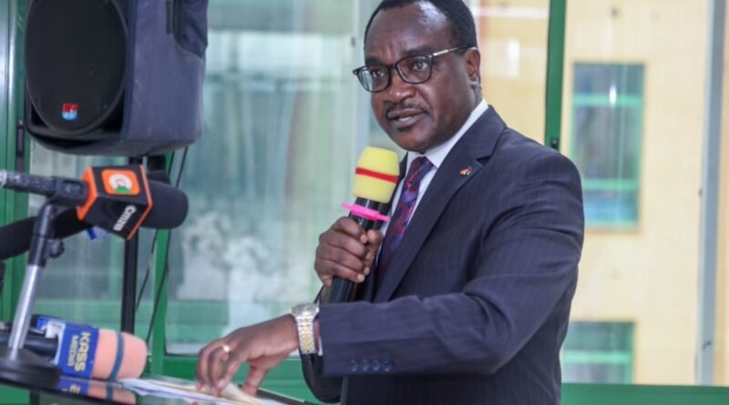 Education Cabinet Secretary Julius Ogamba speaking at KNEC Mitihani House in Nairobi