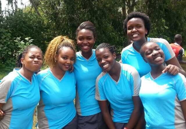 Kenyan girls preparing for a football match in Nairobi.