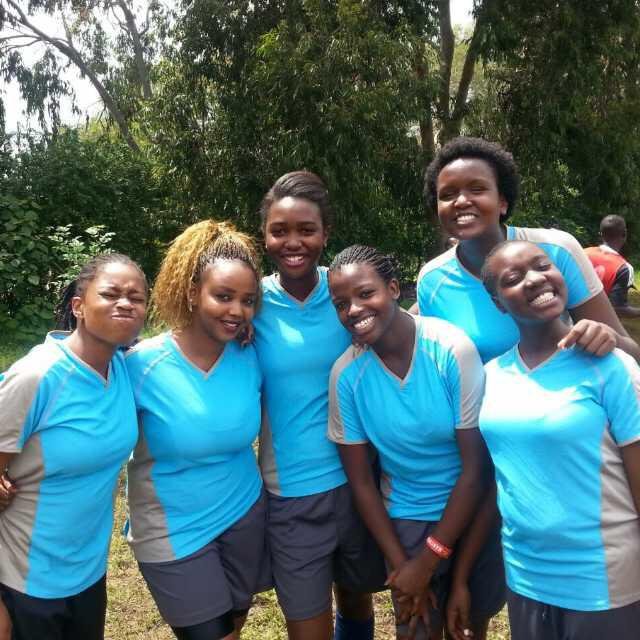 Kenyan girls preparing for a football match in Nairobi.