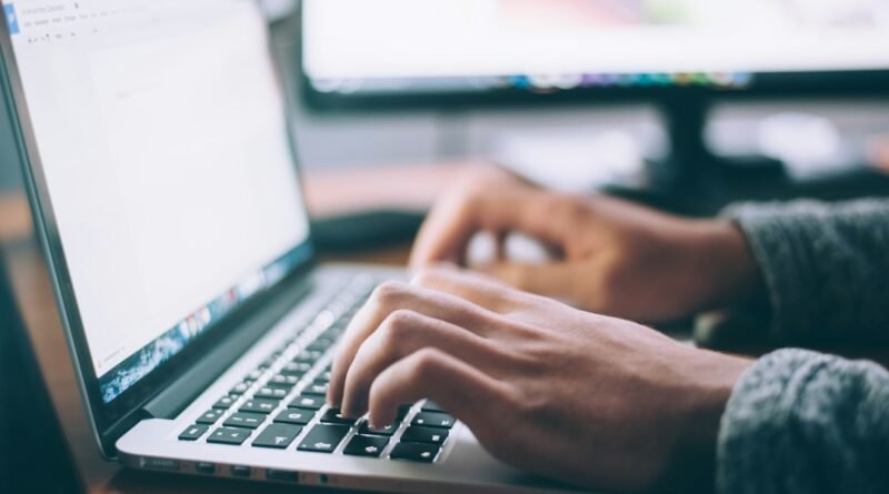 Person using a laptop for tax filing, illustrating KRA's September 2026 iTax downtime penalty waiver.