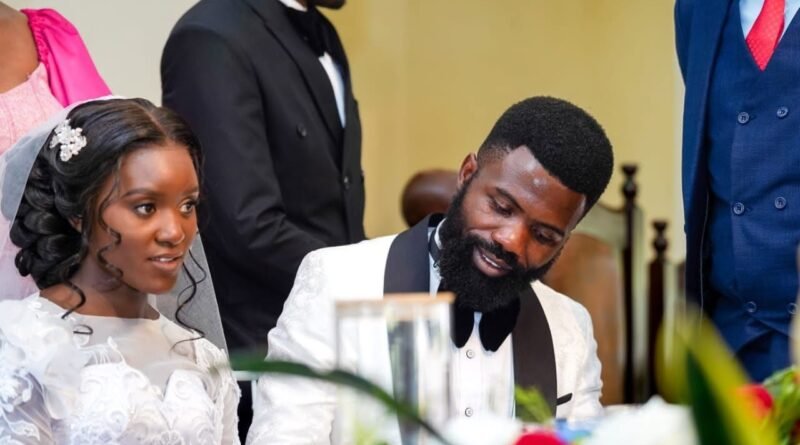 Bride and groom seated together during a wedding celebration