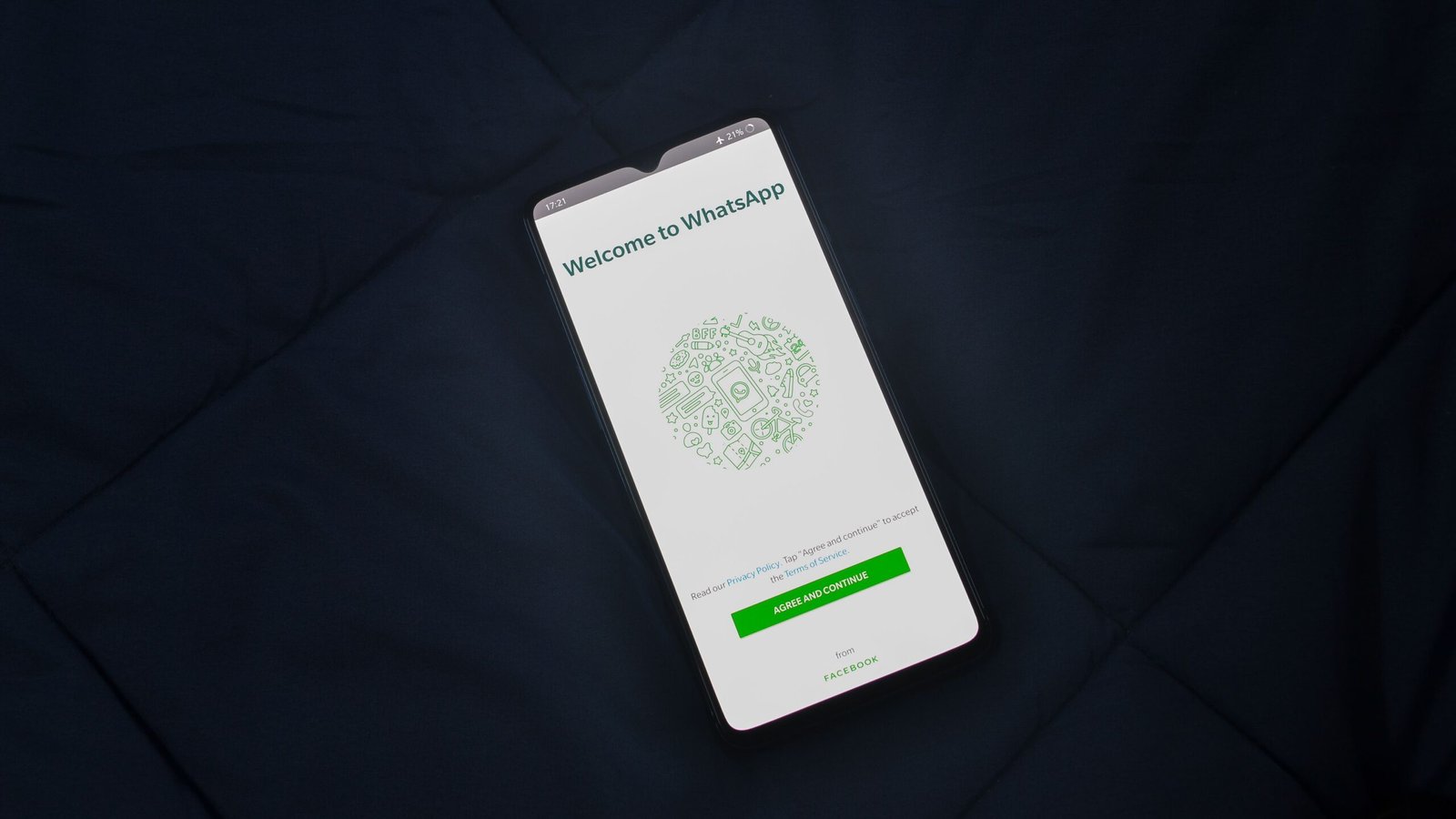 Smartphone displaying WhatsApp as part of an account security and scam awareness guide